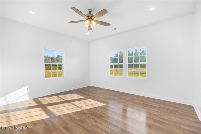 34 Bless Ave, Bolton, NC 28423 - spare room with wood finished floors, ceiling fan, baseboards, and recessed lighting