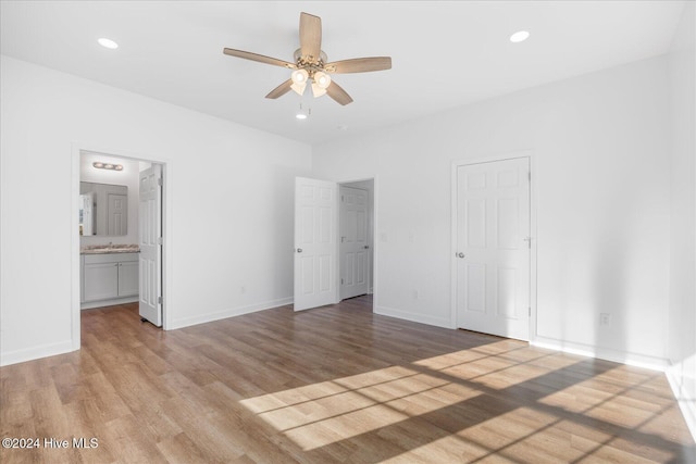 34 Bless Ave, Bolton, NC 28423 - unfurnished bedroom with light wood-style flooring, baseboards, connected bathroom, recessed lighting, and a ceiling fan