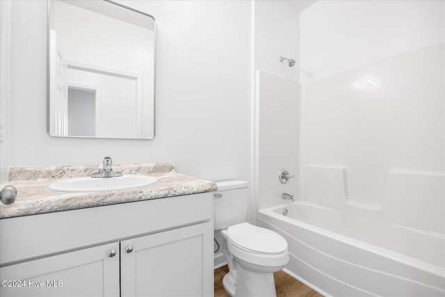 34 Bless Ave, Bolton, NC 28423 - bathroom featuring toilet, vanity, bathing tub / shower combination, and wood finished floors