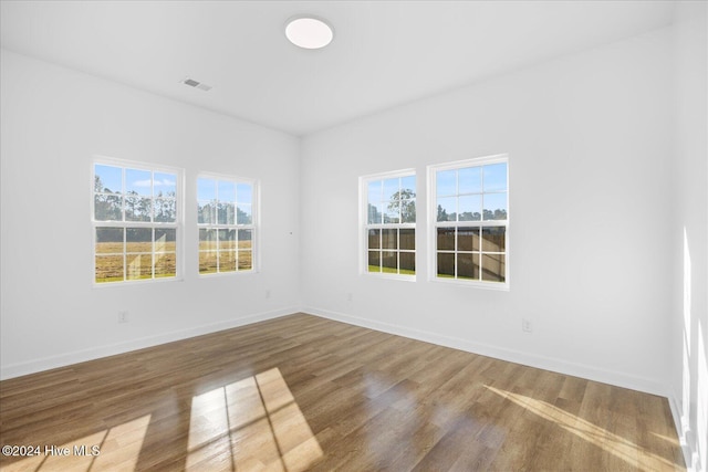 34 Bless Ave, Bolton, NC 28423 - unfurnished room featuring healthy amount of natural light, wood finished floors, and baseboards