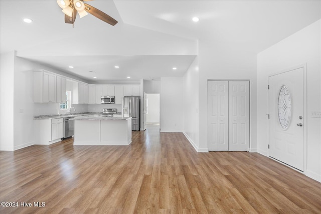 34 Bless Ave, Bolton, NC 28423 - kitchen with stainless steel appliances, ceiling fan, light wood-type flooring, white cabinets, and a sink