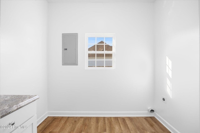 34 Bless Ave, Bolton, NC 28423 - clothes washing area featuring electric dryer hookup, baseboards, electric panel, and wood finished floors