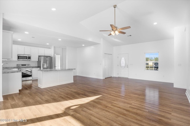 34 Bless Ave, Bolton, NC 28423 - kitchen featuring stainless steel appliances, open floor plan, a center island, recessed lighting, and high vaulted ceiling