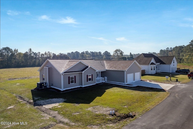 34 Bless Ave, Bolton, NC 28423 - ranch-style home featuring concrete driveway, a front lawn, and central AC