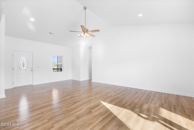 34 Bless Ave, Bolton, NC 28423 - unfurnished living room featuring ceiling fan, wood finished floors, baseboards, recessed lighting, and high vaulted ceiling
