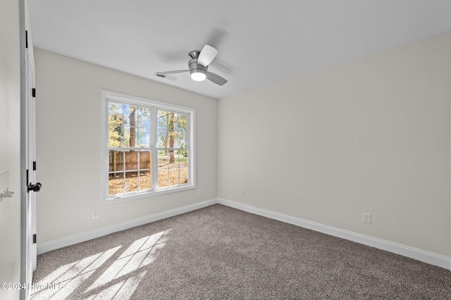 unfurnished room featuring carpet floors and ceiling fan