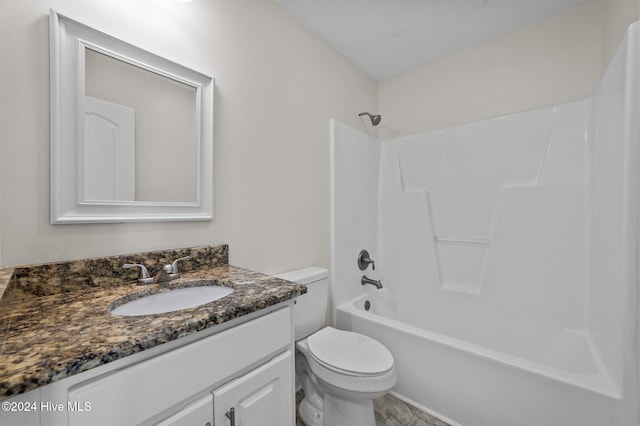 full bathroom featuring vanity, shower / washtub combination, and toilet