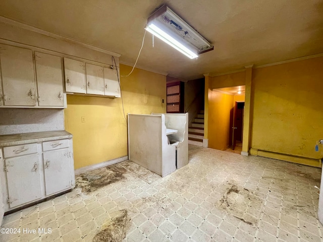 kitchen featuring ornamental molding and baseboard heating