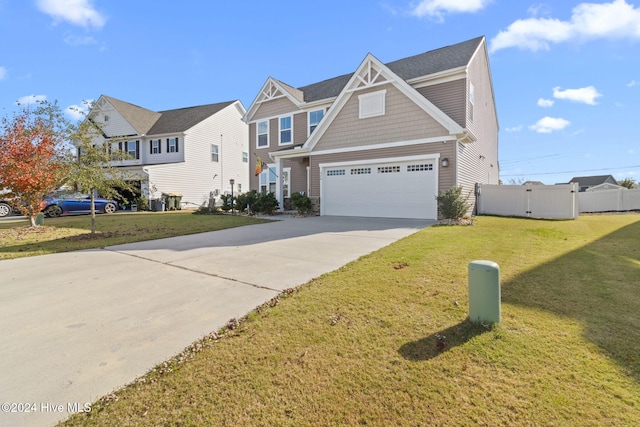 craftsman inspired home featuring a garage and a front lawn