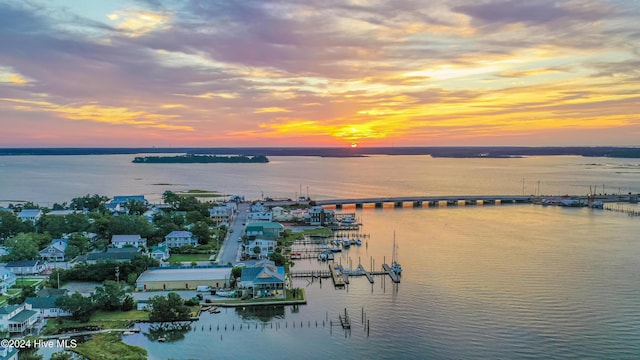 aerial view at dusk with a water view