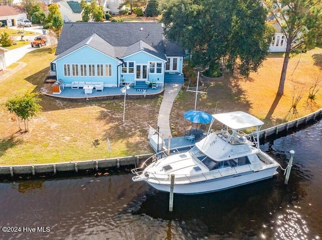 exterior space featuring a patio area and a water view