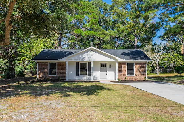 single story home with a front yard and a porch