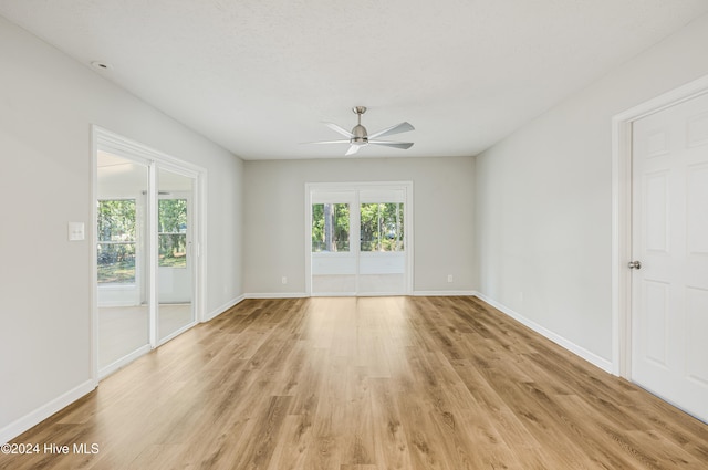 spare room with ceiling fan and light hardwood / wood-style flooring