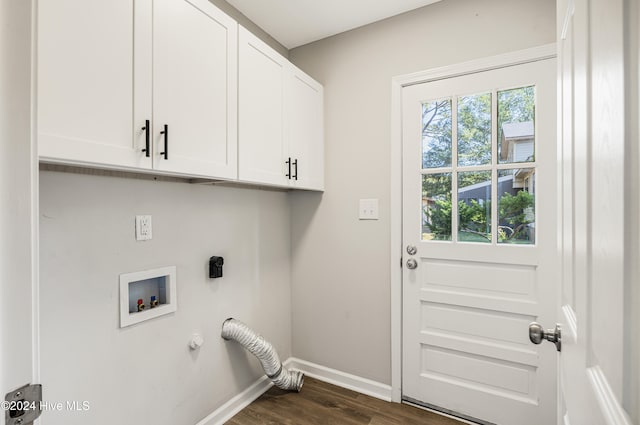 washroom with electric dryer hookup, dark hardwood / wood-style floors, washer hookup, and cabinets