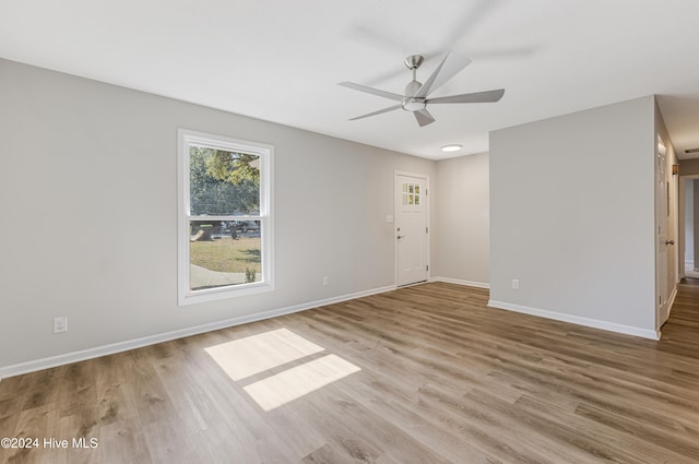 spare room featuring light wood-type flooring and ceiling fan