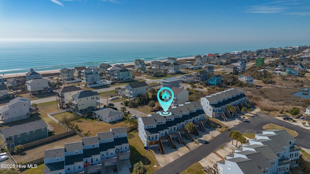 drone / aerial view featuring a water view and a residential view