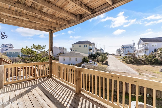 wooden terrace with a residential view