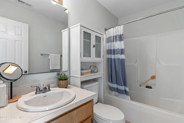 bathroom featuring toilet, shower / tub combo, vanity, and visible vents