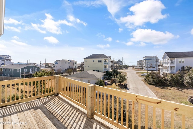 wooden deck with a residential view