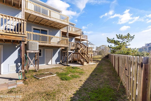 exterior space featuring a fenced backyard and stairs