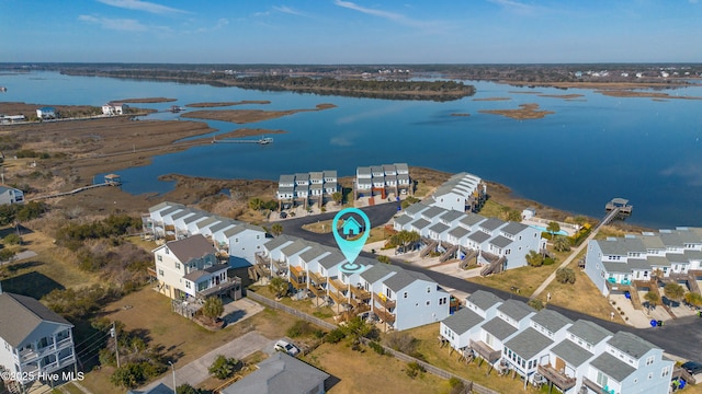 bird's eye view featuring a water view and a residential view