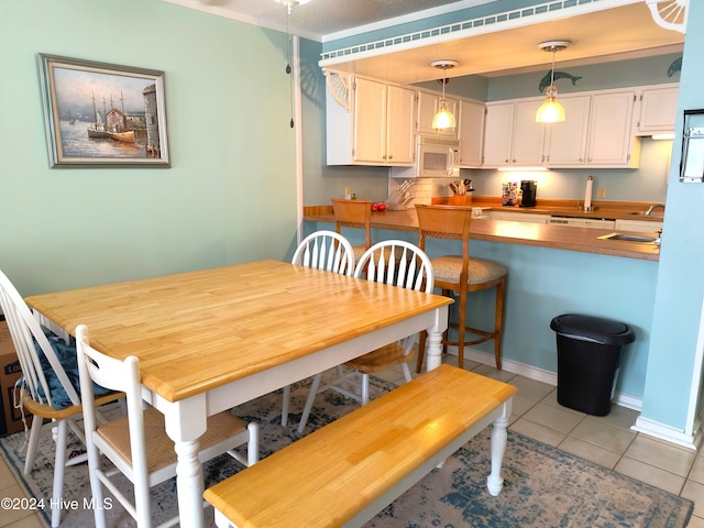 tiled dining area with sink