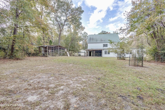 view of yard featuring a sunroom