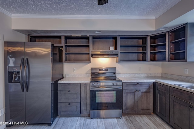 kitchen with light hardwood / wood-style flooring, ventilation hood, a textured ceiling, appliances with stainless steel finishes, and ornamental molding