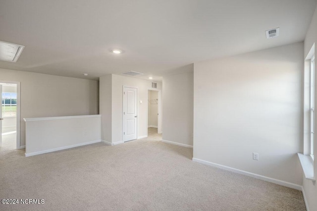 3057 Platinum Cir W, End, NC 27376 - unfurnished room with light colored carpet, recessed lighting, baseboards, and attic access