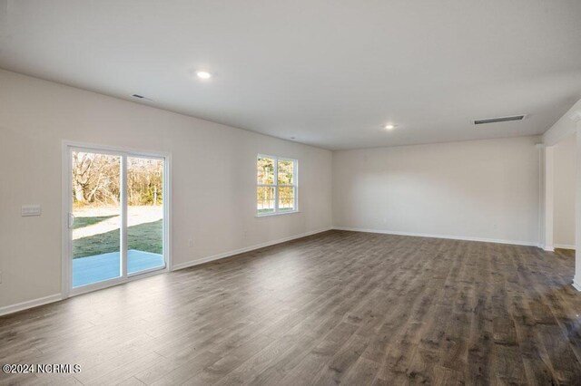 3057 Platinum Cir W, End, NC 27376 - unfurnished room with dark wood-style flooring, baseboards, and recessed lighting