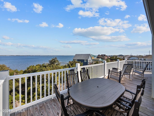 2610 Emerald Dr, Emerald Isle, NC 28594 - deck featuring outdoor dining area and a water view
