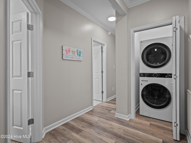 2610 Emerald Dr, Emerald Isle, NC 28594 - washroom with stacked washer / drying machine, ornamental molding, wood finished floors, and baseboards
