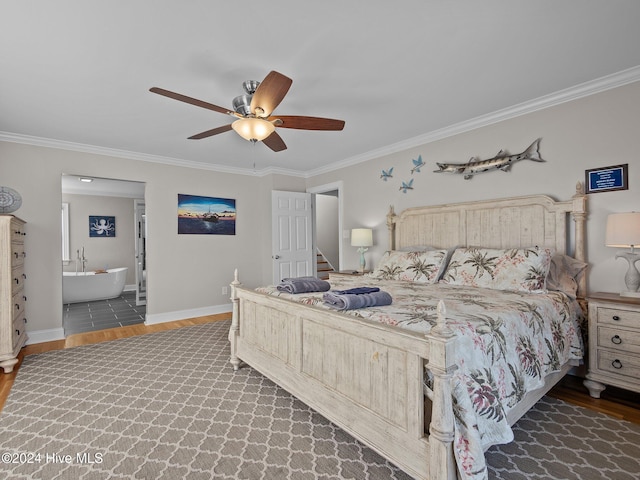 bedroom featuring ornamental molding, ensuite bath, ceiling fan, and dark hardwood / wood-style floors