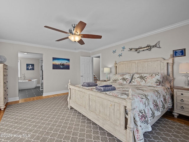 2610 Emerald Dr, Emerald Isle, NC 28594 - bedroom with wood finished floors, ornamental molding, baseboards, ensuite bathroom, and a ceiling fan