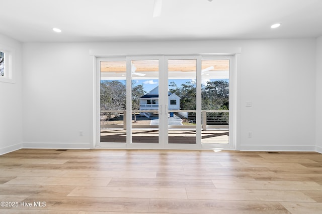 unfurnished room with light hardwood / wood-style flooring