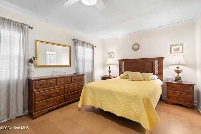 bedroom with multiple windows, ceiling fan, and crown molding