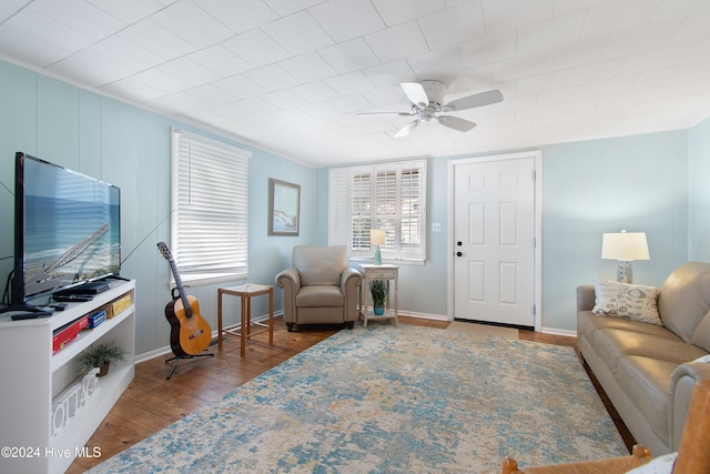 living room with hardwood / wood-style flooring and ceiling fan