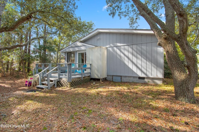 view of property exterior featuring a deck