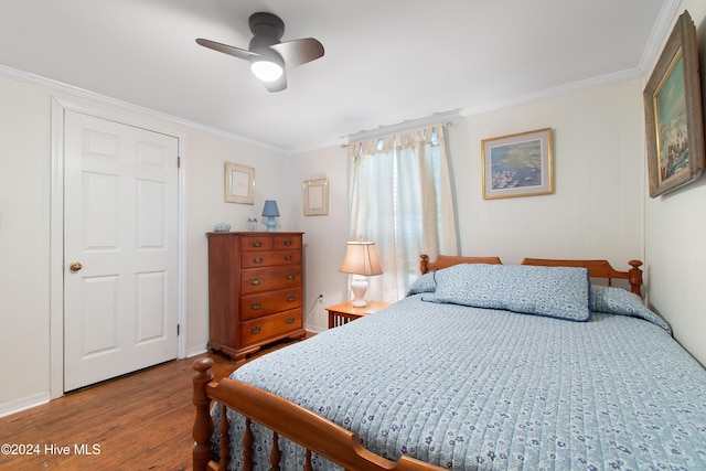 bedroom with crown molding, ceiling fan, and hardwood / wood-style flooring