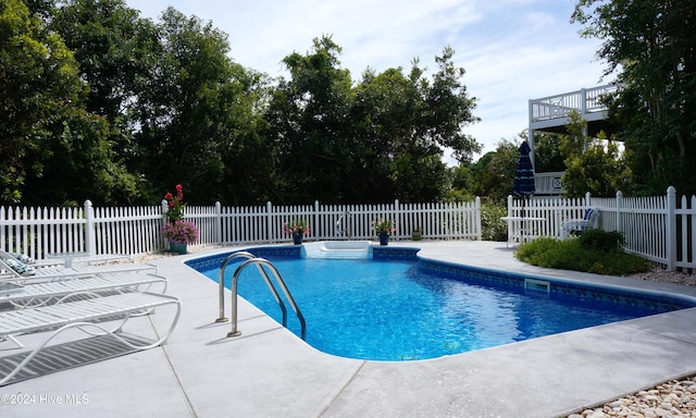 view of swimming pool with a patio