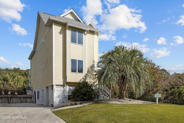 view of property exterior with a lawn