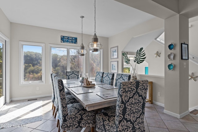 dining space with light tile patterned flooring