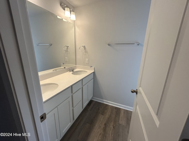 bathroom featuring hardwood / wood-style flooring and vanity