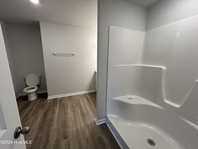 bathroom with toilet and hardwood / wood-style flooring