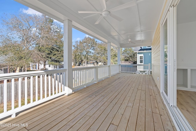 wooden terrace featuring ceiling fan