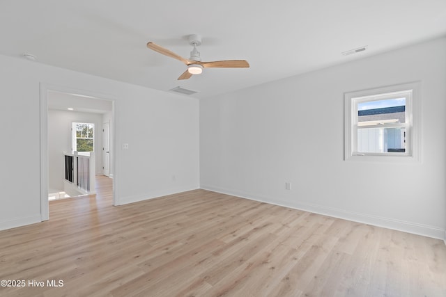 empty room featuring ceiling fan and light wood-type flooring