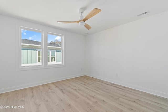 unfurnished room with ceiling fan and light hardwood / wood-style flooring