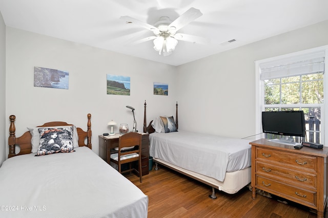 bedroom with ceiling fan and dark hardwood / wood-style floors