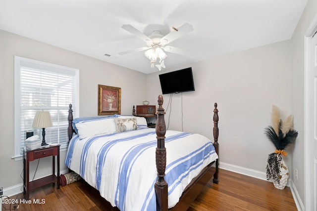 bedroom featuring dark wood-type flooring and ceiling fan