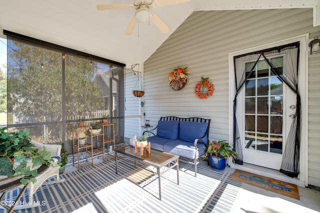 sunroom / solarium featuring ceiling fan, lofted ceiling, and plenty of natural light